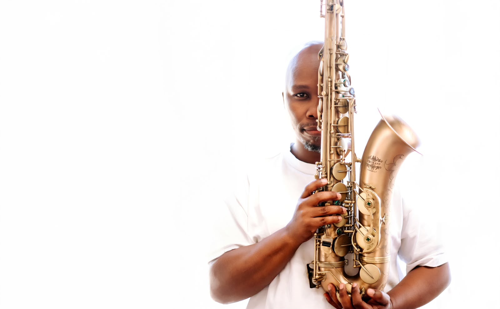 Heart Songs artist holding a saxophone