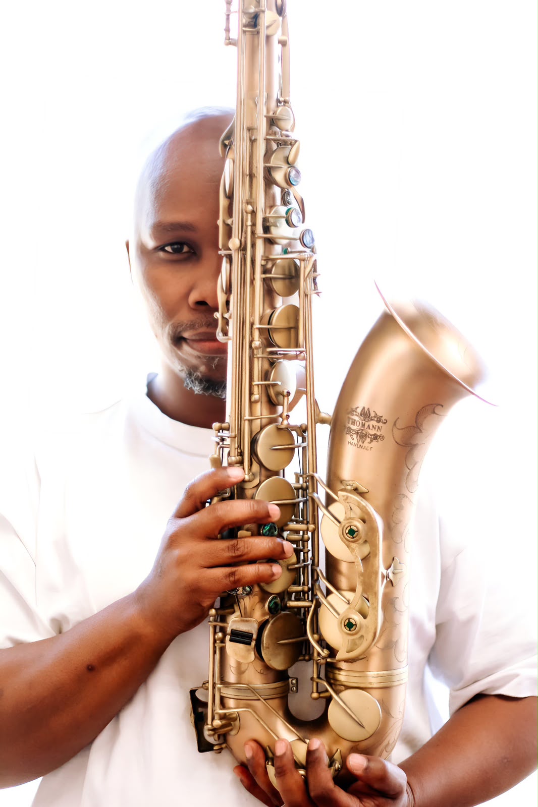 Artist holding a saxophone